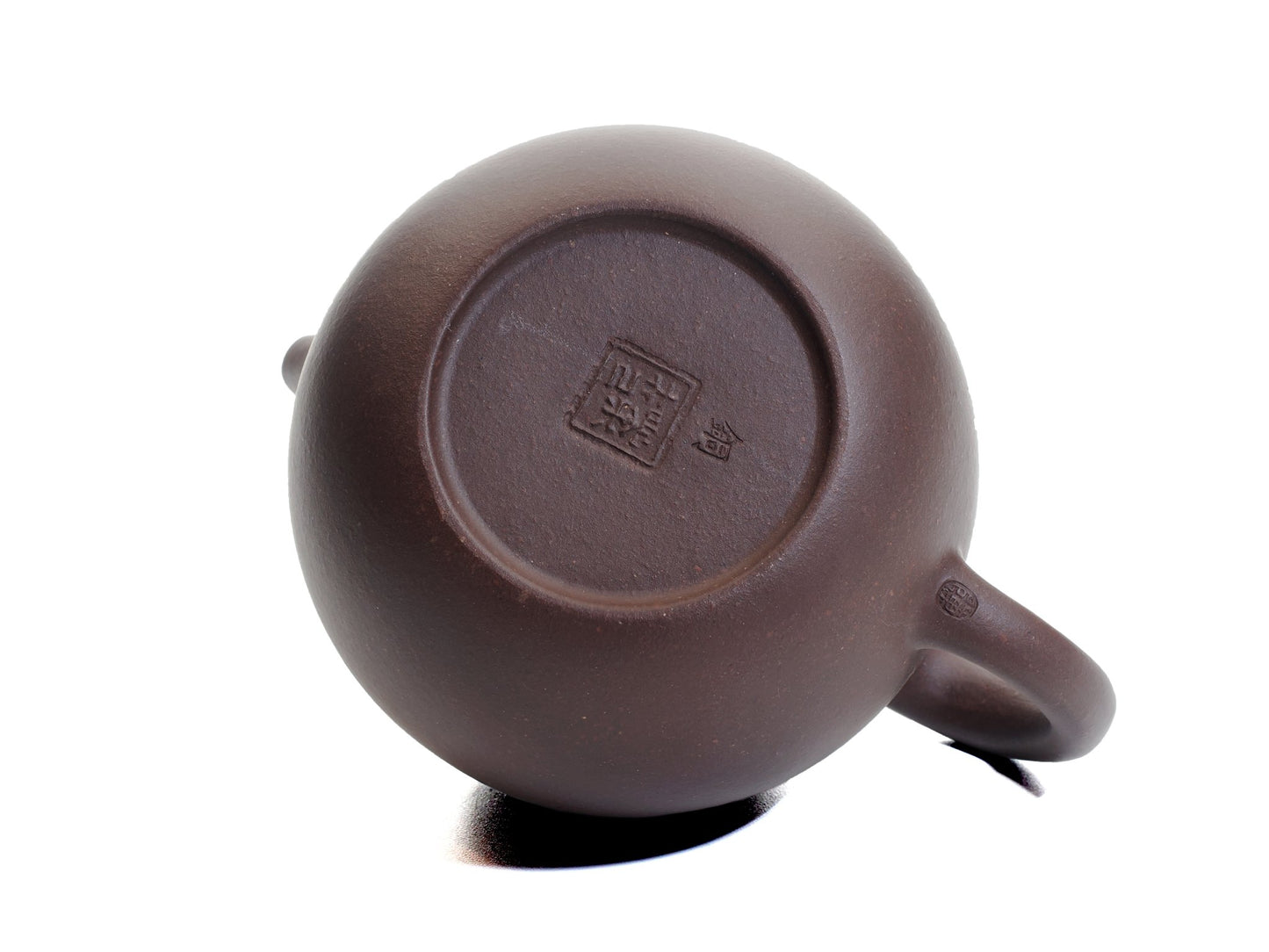 Bottom view of the Da Long Dan teapot showing the potter’s seal stamped into the base of the egg‑shaped pot.