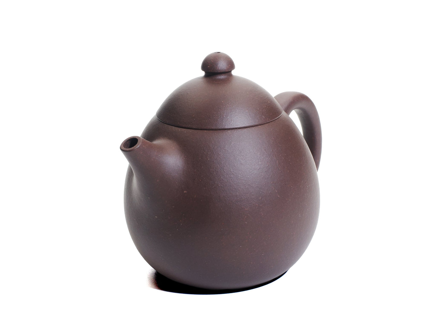 Angled front‑right view of the Da Long Dan Yixing teapot displaying its smooth rounded body, short spout and small domed lid.