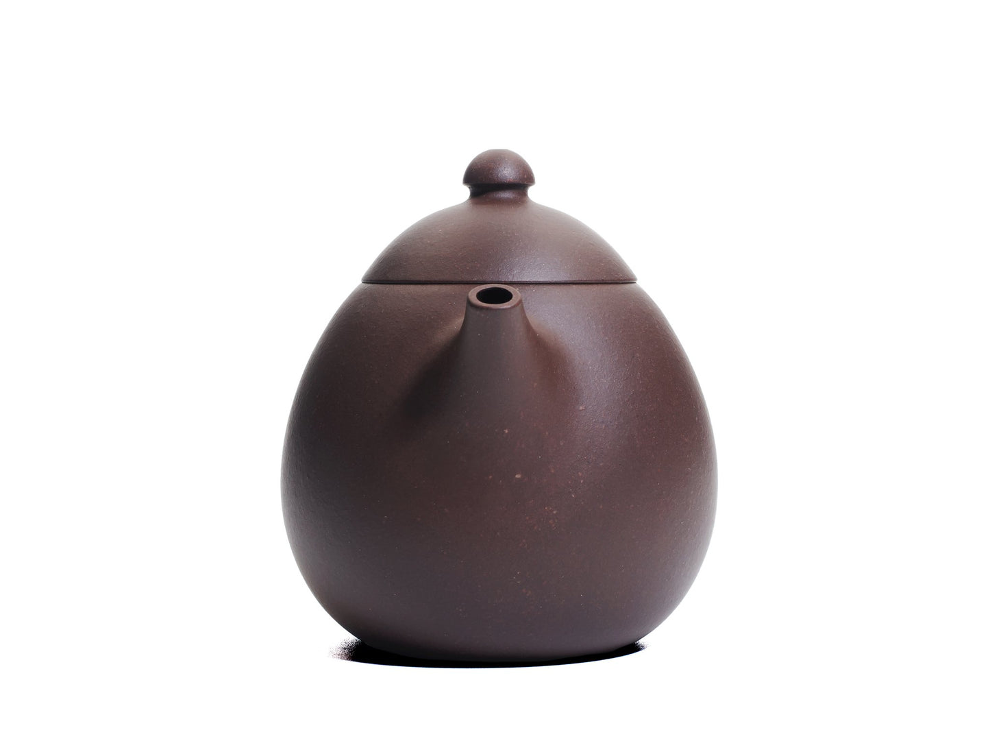 Front view of the Da Long Dan teapot showing the short spout emerging from the plump egg‑shaped body made from bronze grade clay.