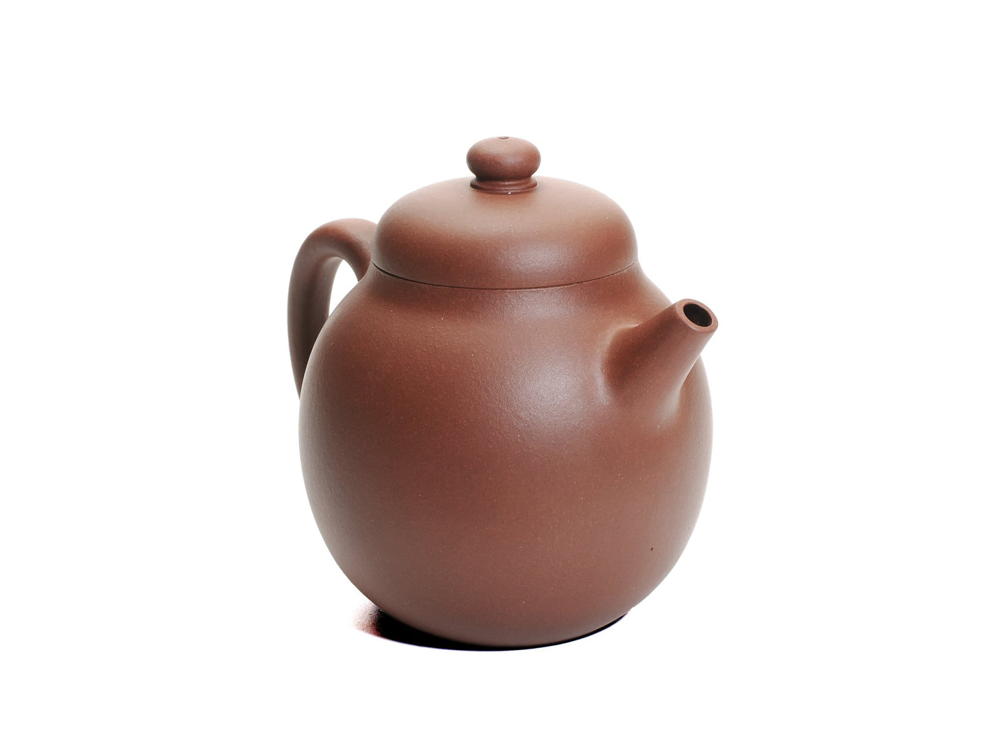 Angled front‑left view of the Zhao Zhuang Hong Ni Da Long Dan teapot, showing its tall egg‑shaped body, short spout and rich reddish‑brown clay.