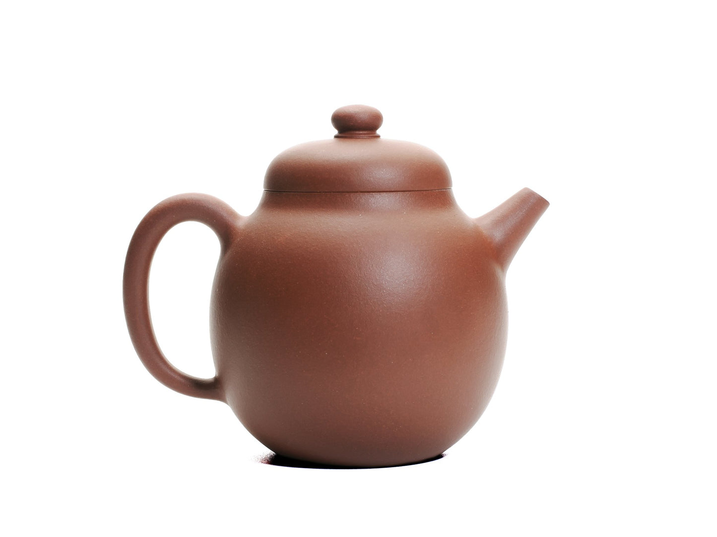 Right side view of the Hong Pi Long Da Long Dan teapot with the curved spout pointing right and the large handle on the left.