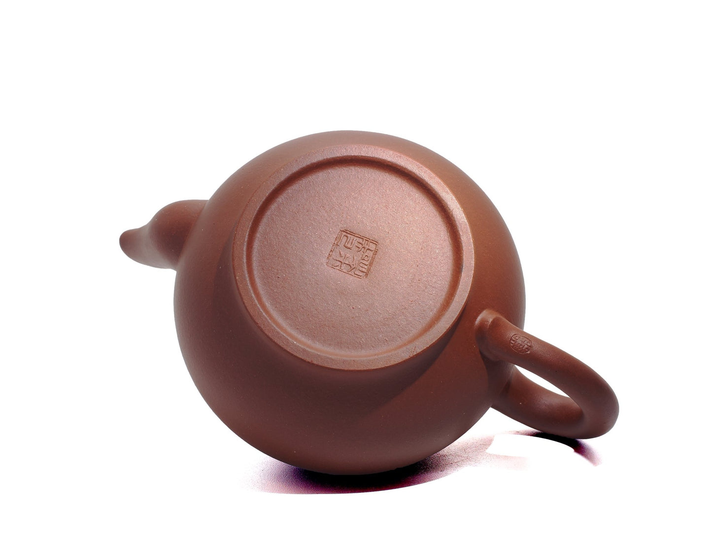 Bottom view of the Xiao Ying Hu teapot highlighting the potter’s seal impressed on the foot ring.