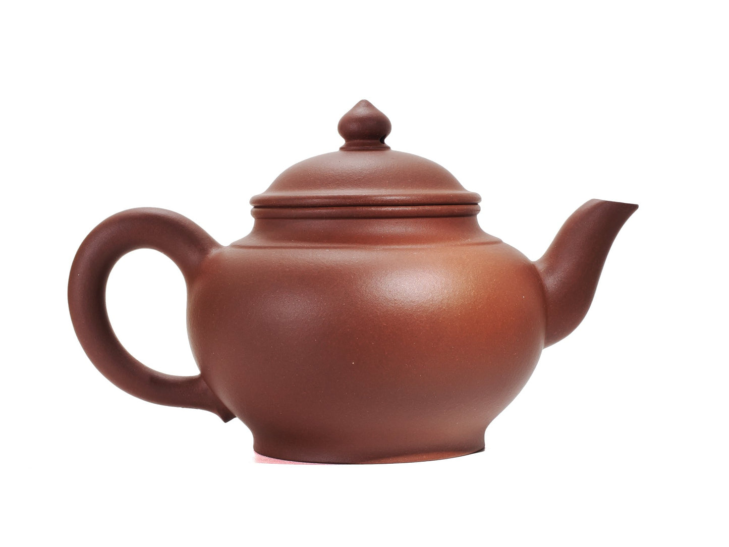 Right side profile of the Hong Pi Long Xiao Ying Hu teapot showing the arched handle and gently curving spout.