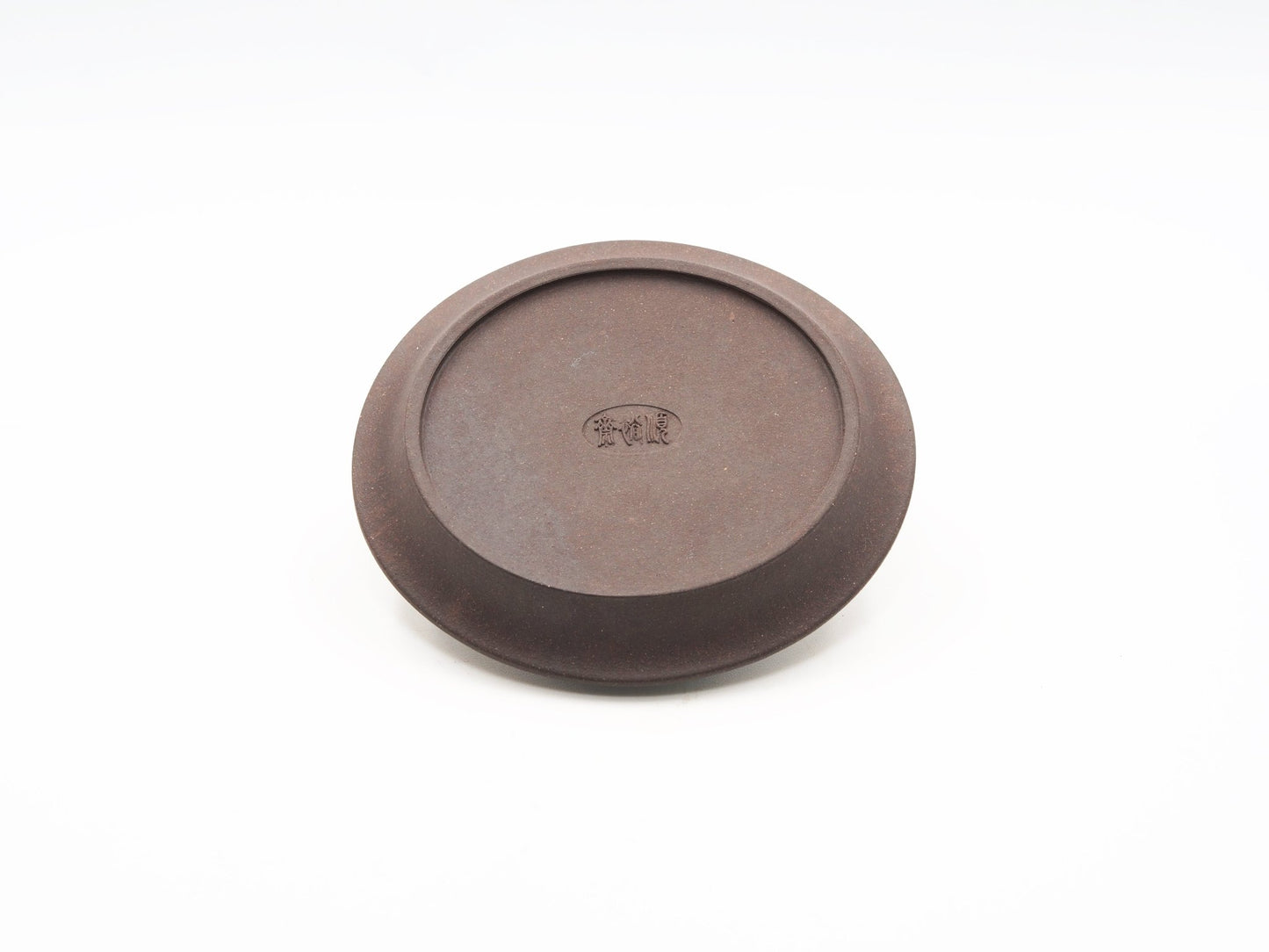 Angled base view showing bottom finish of the carved tea coaster