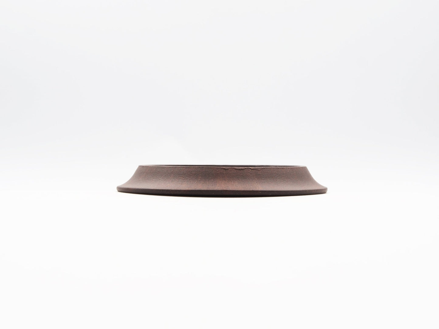 Side elevation of carved Yixing Tea Coaster made with Bronze Grade clay