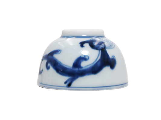 Upside-down view of vintage Jingdezhen porcelain teacup with dragon design