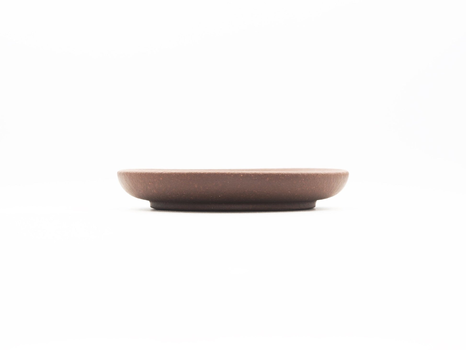 Side profile showing thickness and flat design of Dehou Yixing tea coaster