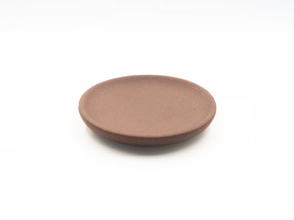 Top view of Lao Zini Dehou tea coaster in round minimalist design
