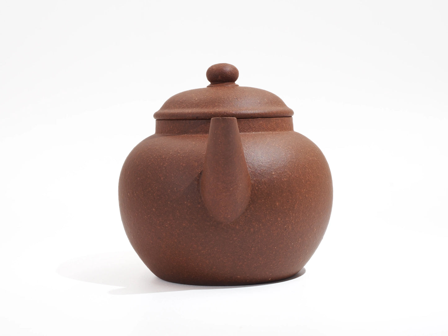 Front view of the Silver Grade teapot, featuring the classic curved spout and the warm, porous clay finish.